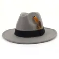 Detailed view of grey wool felt fedora jazz hat with black band and feather decoration. - 58cm / Light Gray