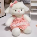 Close-up detail of cute lamb plush toy in pink polka dot dress, soft comforting doll for kids. - Pink Polka Dot Dress / 40CM
