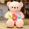 Grande orsacchiotto di peluche rosa con cuscini a cuore, perfetto regalo di San Valentino. - Rosa / 80cm