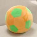 Detailed view of a soft plush soccer ball pillow, featuring orange and green stitched panels. - 20 cm / Orange Green