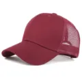 Maroon mesh baseball cap, breathable trucker hat with curved brim for casual wear. - Adjustable / Burgundy