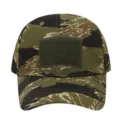 Close up view of tactical baseball cap featuring tiger stripe camo pattern and front loop patch. - Adjustable / Tiger Stripes