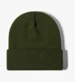 Detailed view of the solid army green knit cuffed beanie close-up texture warm winter cap. - Army Green