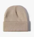 Close-up detail view of the solid color knit beanie, soft textured winter warm cuffed cap. - Khaki