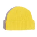 Yellow knit beanie detail shot, thick ribbed acrylic material, cozy winter skull cap. - One Size / Yellow