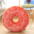 Detailed view of soft donut plush pillow, realistic food cushion for cozy home and office decor. - Snow White