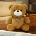 Cute brown teddy bear plush toy with metal pendant, sitting soft stuffed doll gift for kids. - Coffee Bear with Necklace