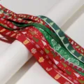 Detailed close-up of Christmas printed grosgrain ribbons featuring festive patterns and text. - Random Christmas Series Style / 12 Pieces/Pack (Width 10-25mm / Length 90cm)
