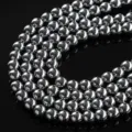 Close-up of polished electroplated silver metallic magnetic hematite beads for DIY jewelry. - 4mm (Approx 102 Pieces) / Silver
