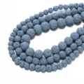 Natural volcanic lava stone bead detail showing porous round basalt texture for DIY aromatherapy. - 6.5mm (Approx 60 Pieces Per Strand) / Light Blue