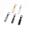 Detailed shot of metal detachable zipper pullers in various metallic finishes for repair. - 5 Pieces/Pack (9x50mm) / Random Mixed Colors