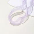 Close-up view of purple organza ribbon with delicate pearl beaded edge detail on white display. - Light Purple