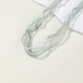 Detailed close-up of sage green organza ribbon with pearl edge, ideal for DIY bows and gifts. - Sea Pine Green