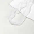 Detail shot of white organza ribbon with delicate pearl edge, perfect for DIY crafts and decoration. - White