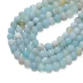 Primer plano detallado de cuentas de ágata natural azul claro, material redondo para bricolaje. - Ágata Rayada Mate Azul Verde / Tamaño 6.5mm
