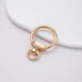 Mosquetón redondo dorado de aleación de zinc para accesorios de bolsos y manualidades DIY. - 1 Pieza / Dorado