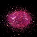 Macro detail shot of sparkling pink hexagonal nail art glitter sequins and powder. - Laser Plum Red Hexagonal Iridescent Sequins