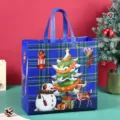 Blue plaid Christmas non-woven gift bag with cute snowman and tree print for holiday shopping. - Blue Plaid