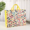 Bolsa de compras de tela no tejida floral colorida bolsa reutilizable para uso diario. - Cuadros Amarillos