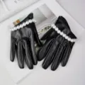 Black short faux leather gloves with pearl wrist trim, perfect for cosplay and fashion photo. - Black