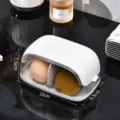 Portable makeup sponge storage box with dust-proof lid, partitioned cosmetic beauty egg holder. - White