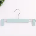 Light green plastic pants hanger with adjustable clips, durable clothes storage rack. - Plain Pants Hanger - Nordic Blue