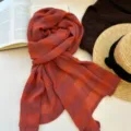 Autumn red blue plaid scarf detail, artistic cotton linen texture shawl accessory. - Orange