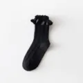 Black Lolita crew socks with satin ruffle cuff and cable knit details for sweet JK style. - One Size / Black Braided