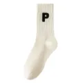 White mid-calf cotton socks for women and men, featuring a stylish black letter P embroidery. - One Size / White