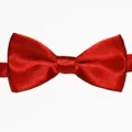 Rote Satin Fliege Detail Nahaufnahme, glänzendes zweilagiges Stoff Accessoire für Kinder. - Hellrot