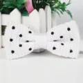 White knitted bow tie for men with black polka dots, classic casual wedding necktie main view. - White with Black Polka Dots
