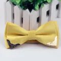 Yellow jacquard bow tie with silver dots and metallic corner decorations for formal men's wear. - Golden