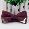 Men's burgundy polka dot bow tie with chic gold metallic corners for formal British fashion style. - Burgundy