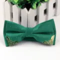 Green jacquard bow tie with silver dots and metal corners for formal men's wear accessory. - Verdant