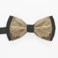 Detail shot of a black and gold double layer men bow tie with metal corner decor. - Champagne