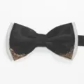 Detail view of men's double layer bow tie with metal corners and black white fabric. - White Background Black
