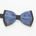Close-up detail of the stylish blue and black men's bow tie featuring ornate metallic corners. - Sky Blue