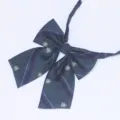 Detail shot of dark green plaid JK bow tie featuring elegant crown crest embroidery and smooth ribbon. - Dark Green Plaid Crown (LH-HG06)