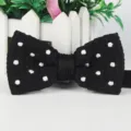 Men's black knitted polka dot bow tie, perfect for business, wedding, and casual formal wear. - Black
