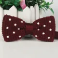 Men's burgundy knitted bow tie featuring classic white polka dots, ideal for casual and formal wear. - Burgundy