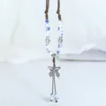 Retro Chinese style ceramic sweater chain with blue white beads and butterfly pendant variant. - He Ning