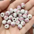 White ceramic loose beads with pink floral decal, perfect for DIY jewelry making and crafts. - Pink Plum Blossom