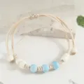 Handmade braided ceramic bead bracelet featuring charming blue and white beads for daily wear. - Bodhi Light Blue Style