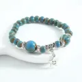 New Chinese style ceramic beaded bracelet with metal spacers and a cute smiley star pendant. - CS014 Carrying Stars (Blue)