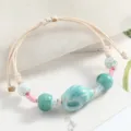 Handcrafted ceramic bead bracelet with braided cord, artistic style, adjustable couple jewelry. - Two-Tone Rope Conch (Isatis Blue)