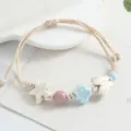 Woven ceramic bracelet featuring cute butterfly and star beads, adjustable braided cord jewelry. - Star and Butterfly / Light Blue