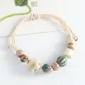 Handmade ceramic beaded bracelet with star charm and braided cord, ethnic style jewelry. - Small Star Style (Milky White)