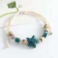 Handmade ceramic bead bracelet featuring woven cord and unique glazed charms for women. - Small Starfish (Spotted Green)