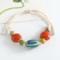 Handmade ceramic beaded bracelet with woven rope, unique ethnic style gift for women. - Long Pumpkin Bead (Blue)