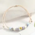 Handmade woven ceramic bead bracelet with cute smiley face charm, aesthetic couple jewelry. - Laughter and Joy